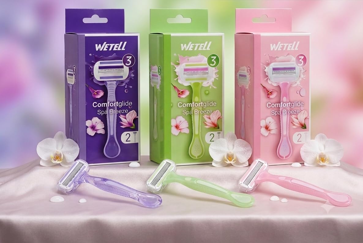 WETELL Comfortglide Spa Breeze razor packaging in assorted colors