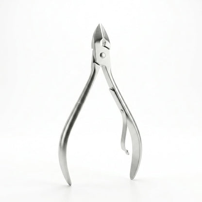 Silver stainless steel cuticle nipper on white background