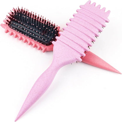 Pink curl defining brush shown at an angle
