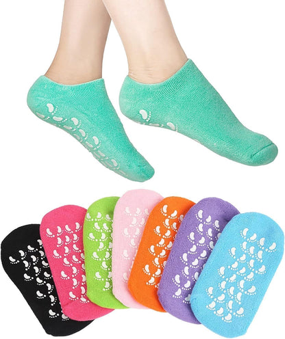 Pink and blue silicone gel spa socks showing gripped soles