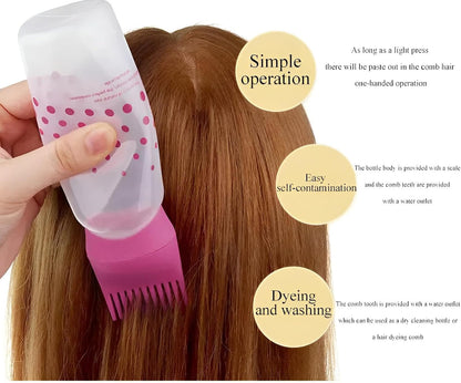 Pink comb-tip hair oil applicator bottle being used on hair