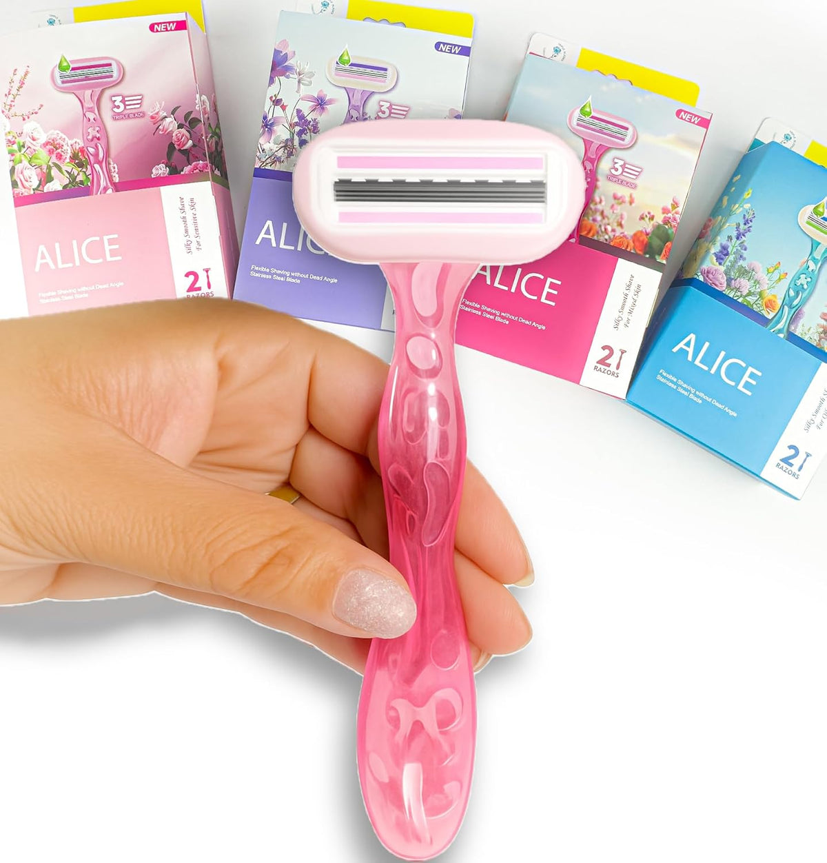 Close-up of a light-pink Alice body shaver with flexible triple-blade head