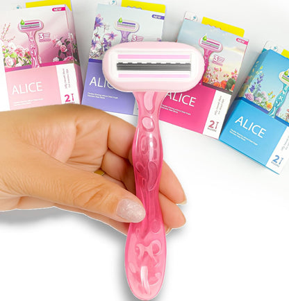 Close-up of a light-pink Alice body shaver with flexible triple-blade head