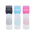 Hair oil applicator bottles with black, blue and pink comb tips